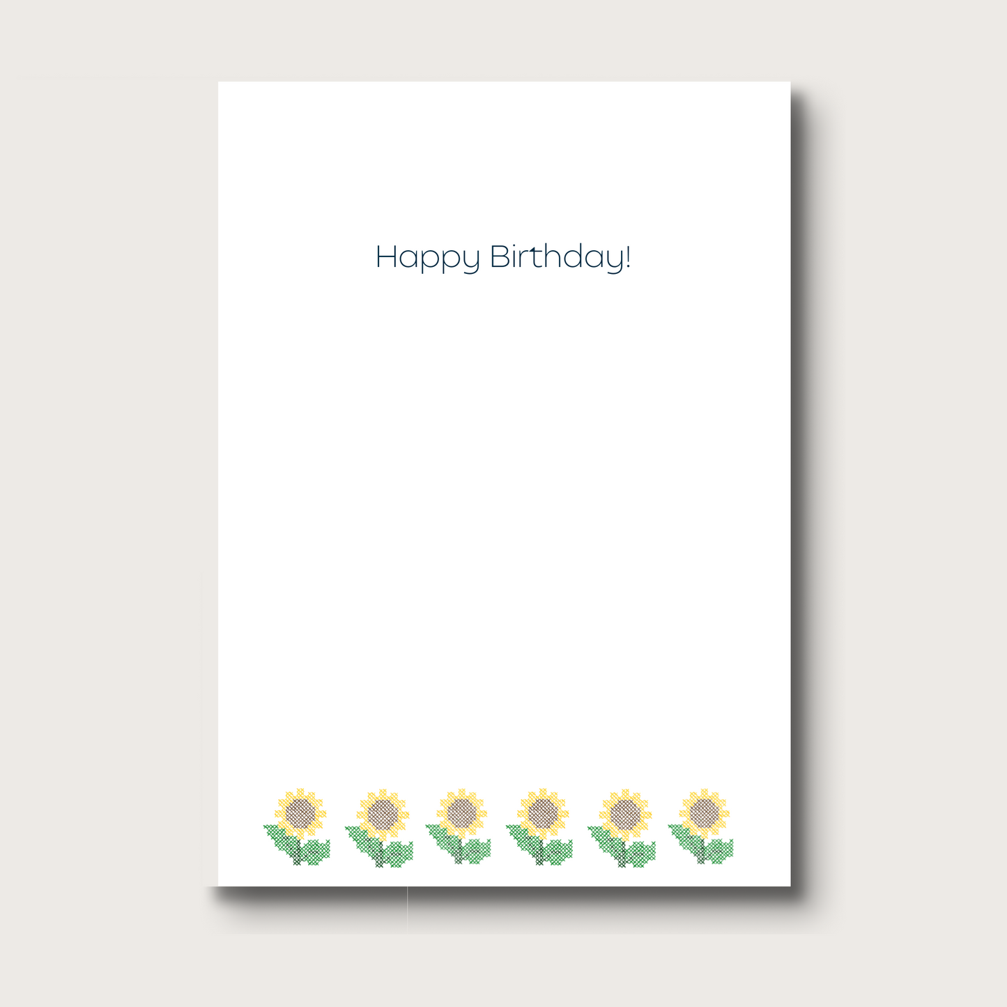 White card with cross-stitched sunflower illustrations and 'Happy Birthday!' text on a white background