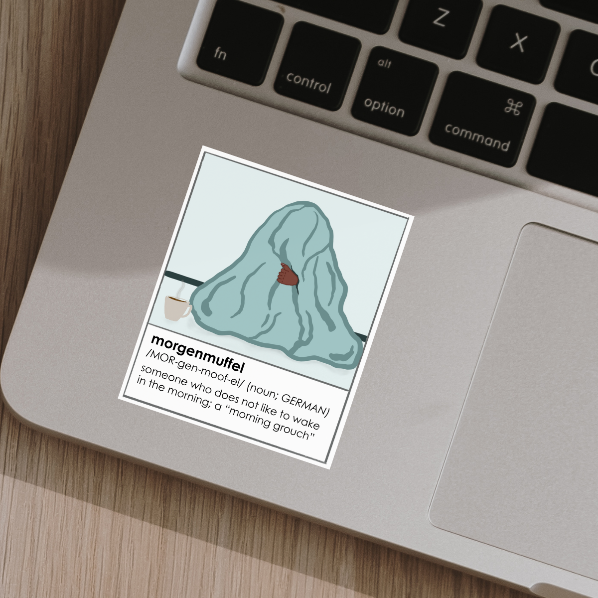 Sticker with definition on a laptop