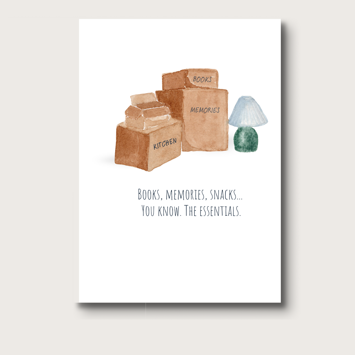 A stack of moving boxes, one open. The boxes are labeled Books, Kitchen, and Memories. A green lamp with a white shade is to the right of the stack of boxes. The black text below the watercolor image reads "Books, memories, snacks. You know, the essentials."