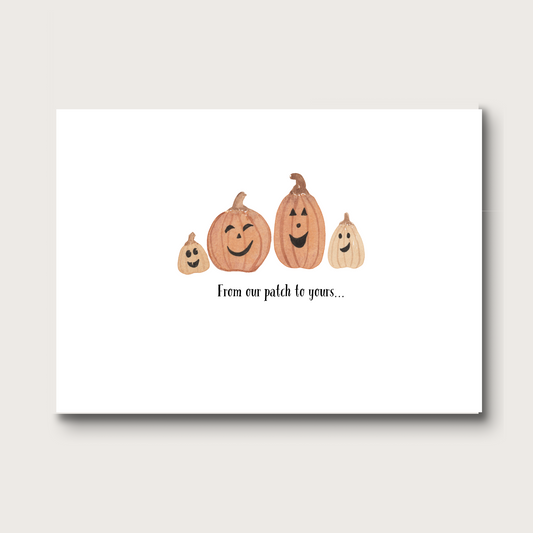 Halloween-themed card with a family of pumpkins on a white background