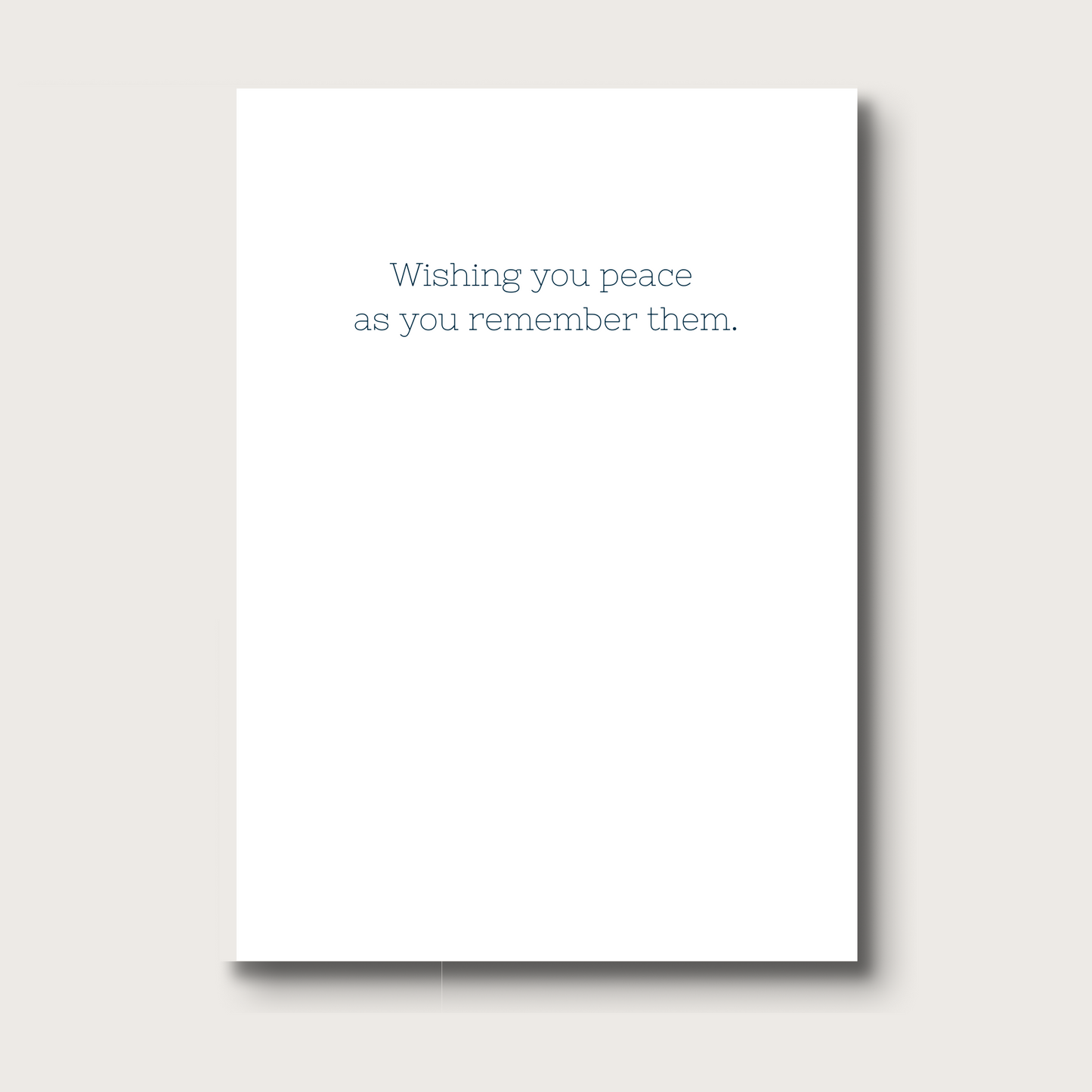 White card with text 'Wishing you peace as you remember them'