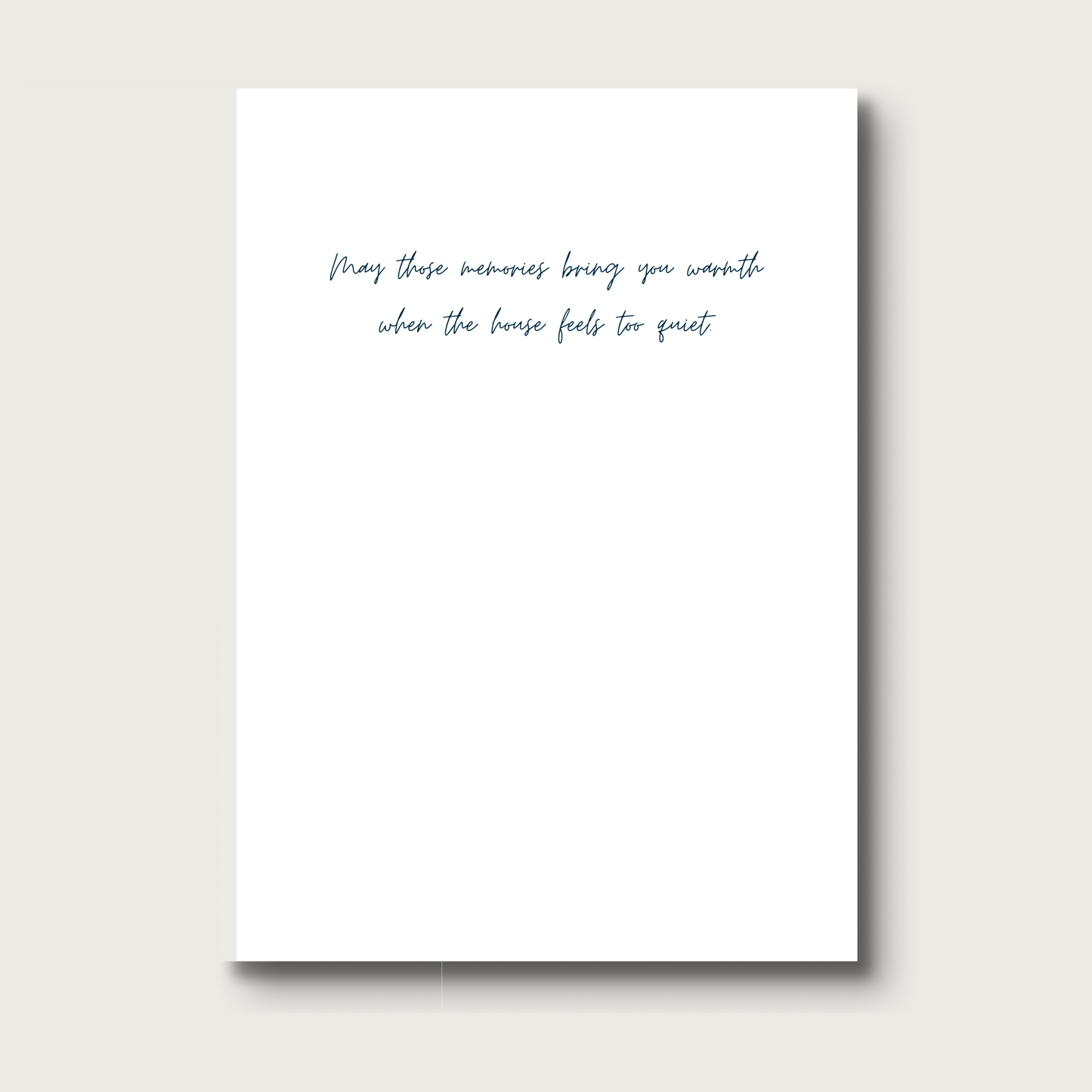 White card with black text that reads "May these memories bring you warmth when the house feels too quiet"