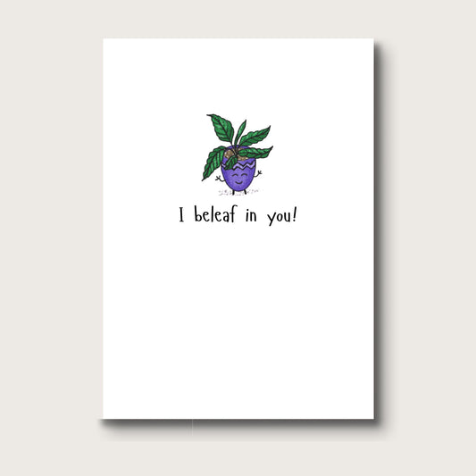 Cheerful digital illustration of a green leafy plant in a smiling purple pot, captioned “I beleaf in you”.