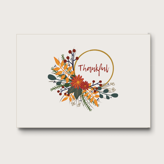 Notecard with autumn wreath floral design and 'Thankful' text on a soft background