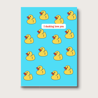 Greeting card with a playful pattern of yellow rubber ducks on a blue background. The text reads "I Ducking Love You" in print. A humorous and lighthearted card, perfect for expressing affection with a wink. 