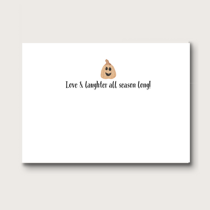 Inside of note card with a pumpkin face emoji and text 'Love & laughter all season long!' on a white background