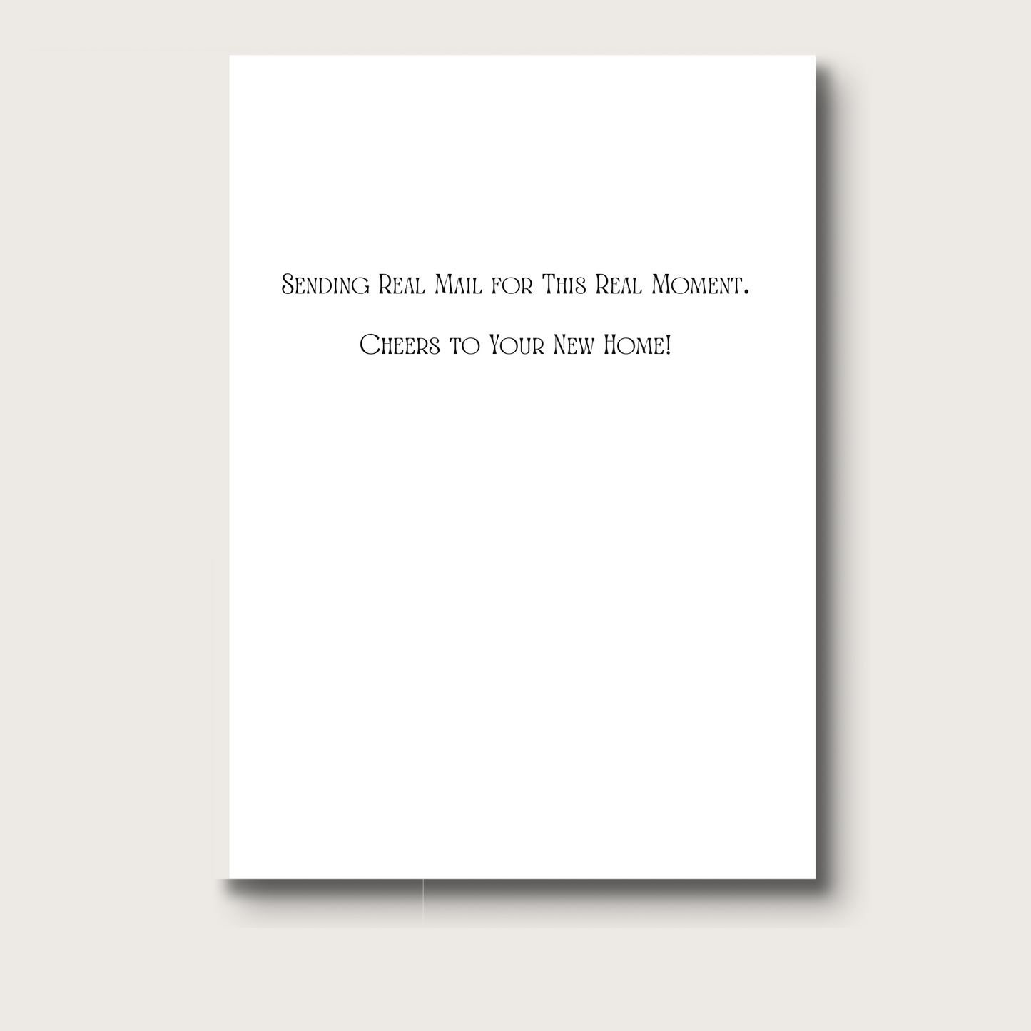 The inside of the card reads in black text "Sending real mail for this real moment. Cheers to your new home!"