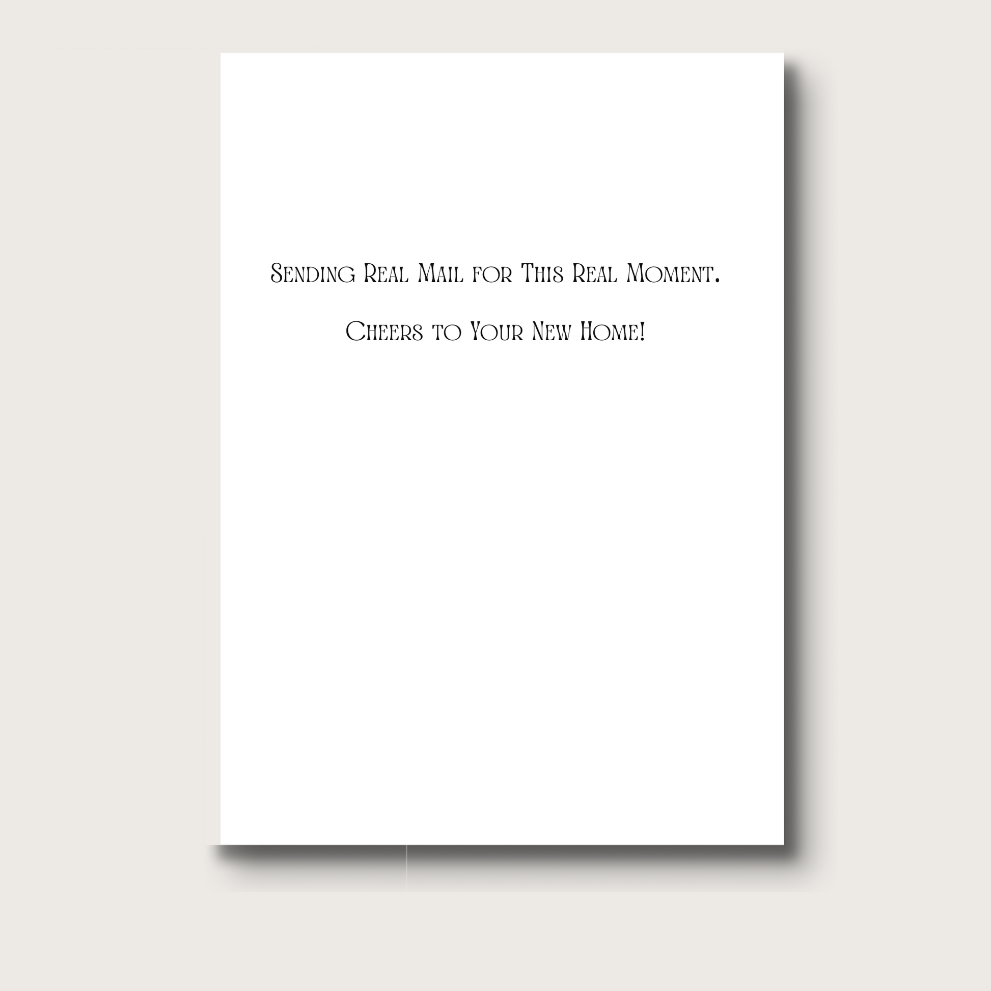 The inside of the card reads in black text "Sending real mail for this real moment. Cheers to your new home!"