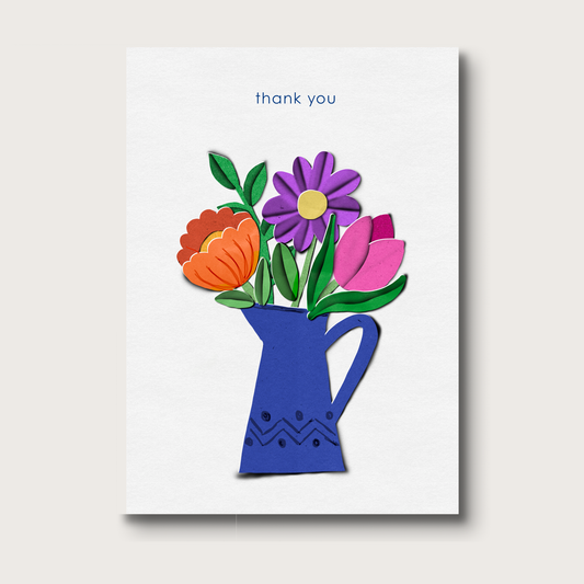 Card with colorful flowers in a blue pitcher and 'thank you' text on a textured white background