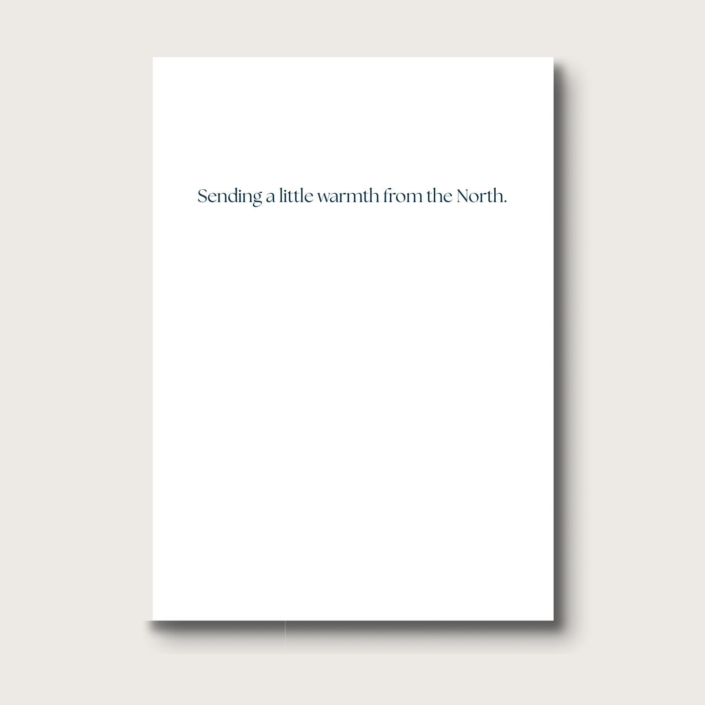 White card with text 'Sending a little warmth from the North' on a white background
