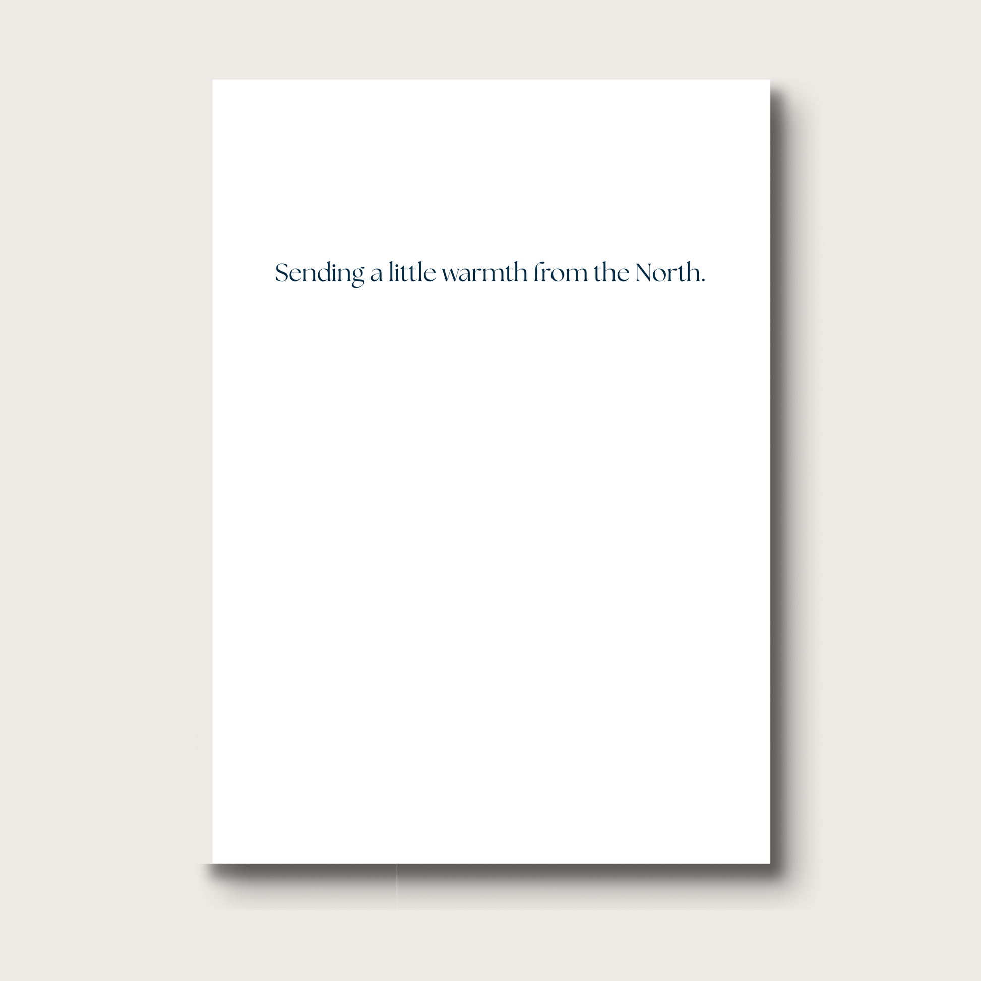 White card with text 'Sending a little warmth from the North' on a white background
