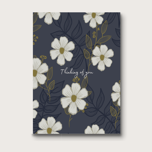 Floral greeting card with 'Thinking of you' text on a dark blue background