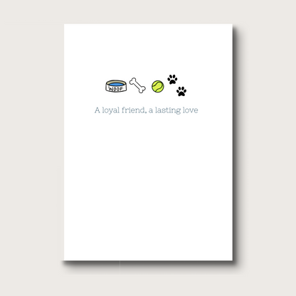 A white card with a dog bowl that reads WOOF, a dog bone, a tennis ball and paw prints across the top. Underneath reads: A loyal friend, a lasting love
