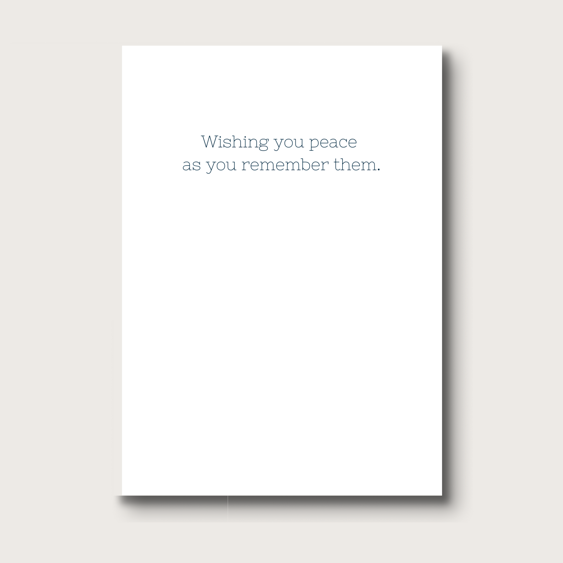 White card with text 'Wishing you peace as you remember them' 
