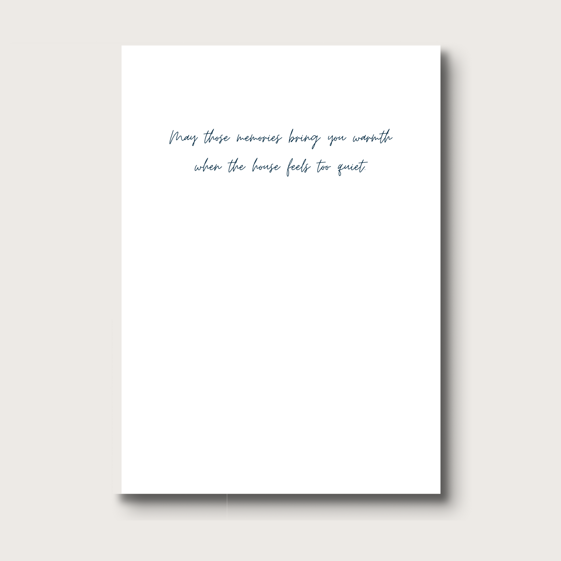 White card with black text that reads "May these memories bring you warmth when the house feels too quiet" 